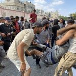 Dozens killed by Israeli fire as they sought desperately needed aid in Gaza, Palestinian health ministry says